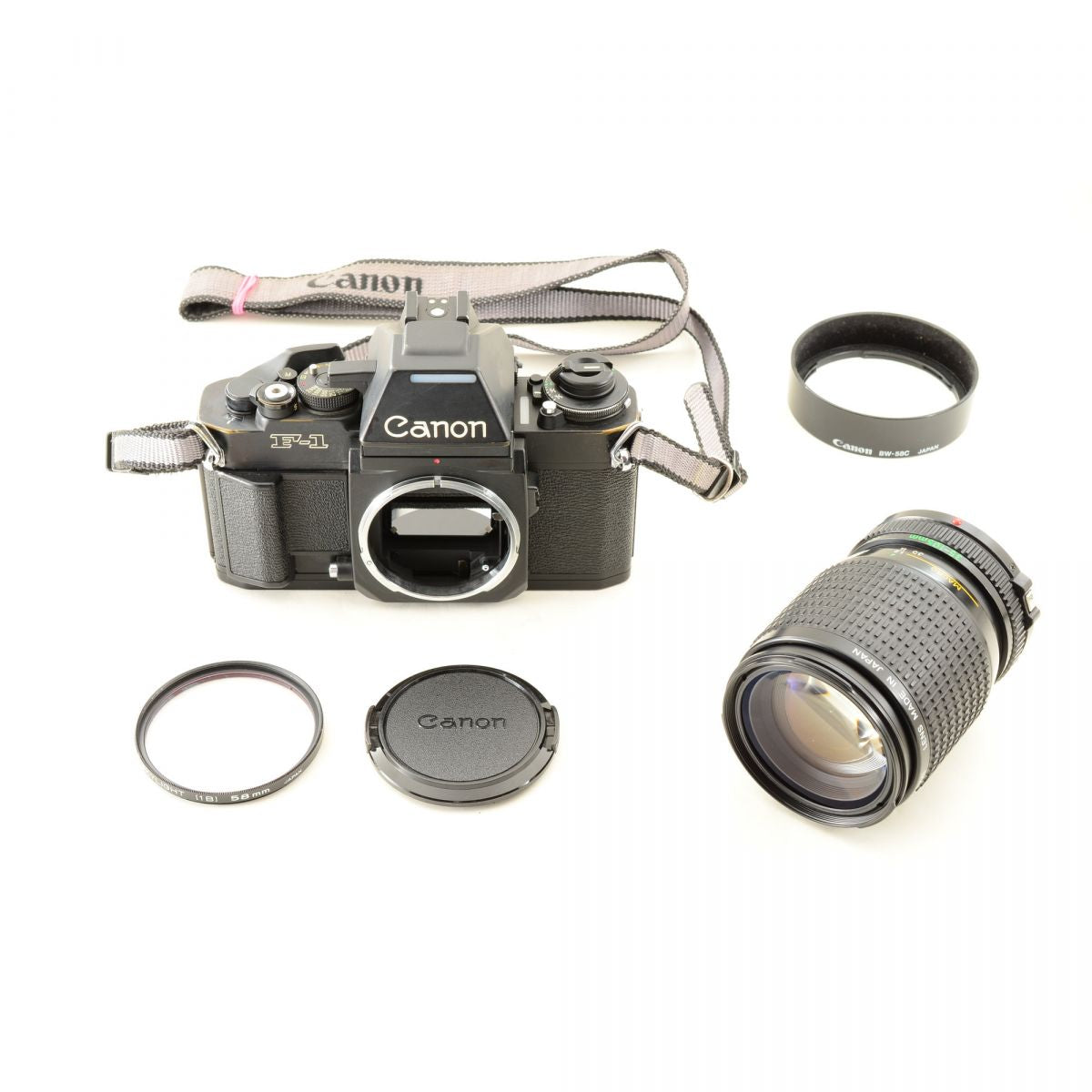 【中古】Canon New F-1 アイレベル 35mm フィルムカメラ + New FD 35-105mm f/3.5-4.5 ズームレンズ キャノン S/N: 224918